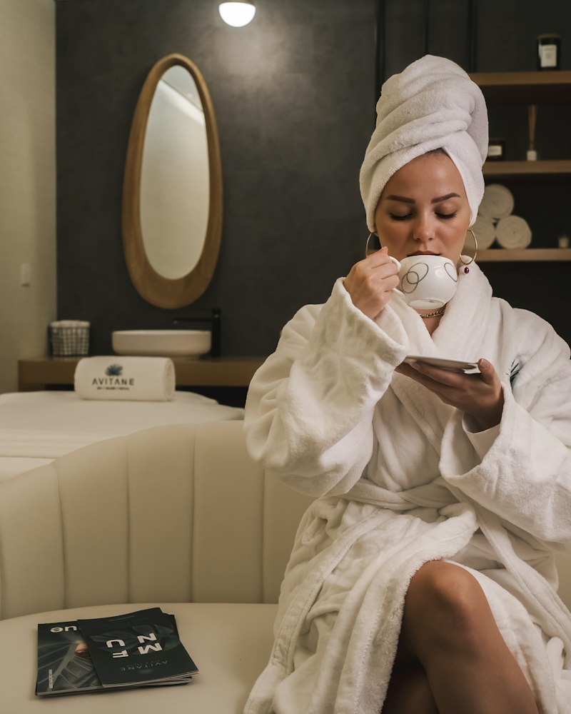Guest relaxing with tea in a spa lounge