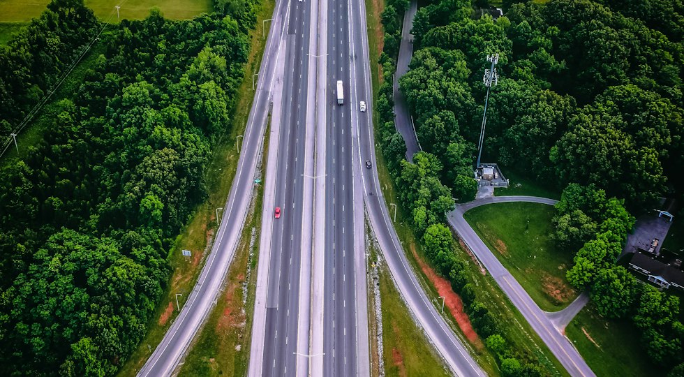 Expressway running through green forest near Khopoli